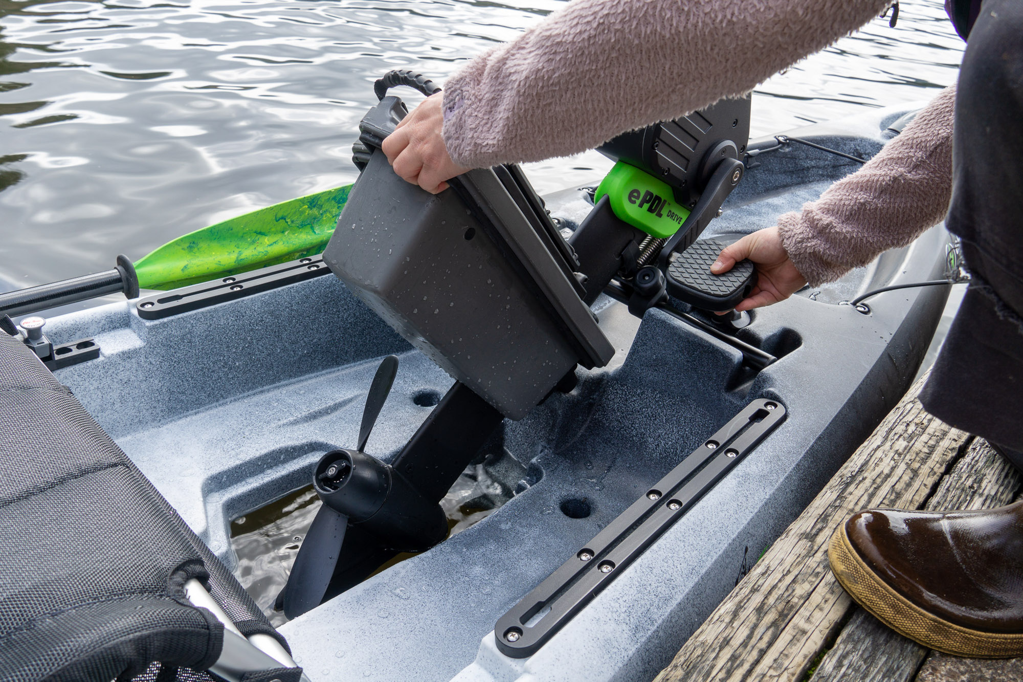A paddler sets the ePDL prop drive into the Malibu kayak