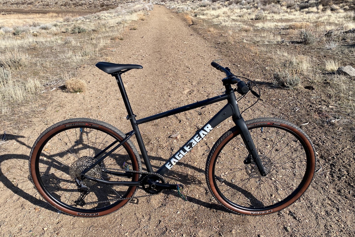 Profile shot of the Eaglebear Black Everyday bike on a gravel road