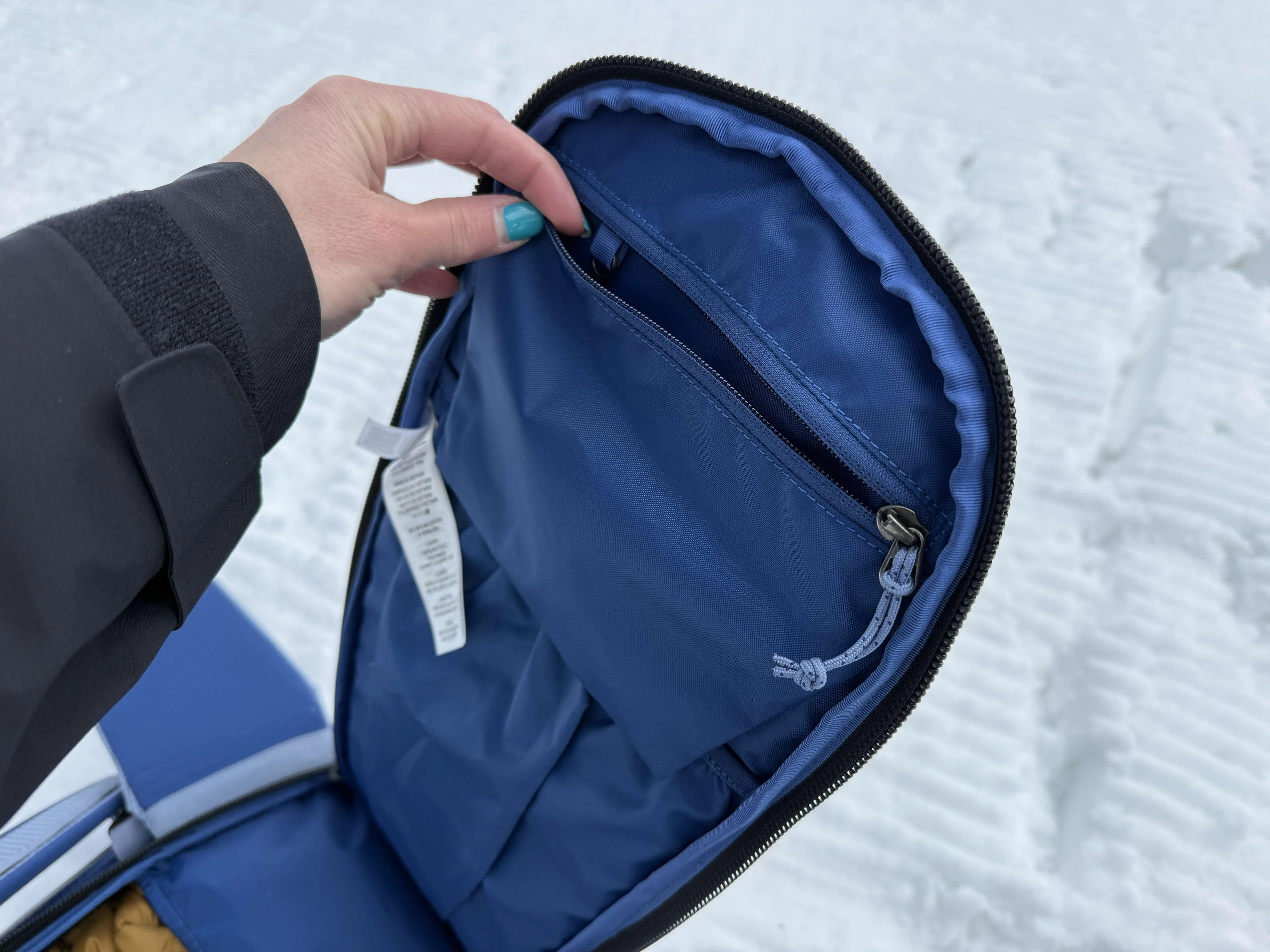 A small pocket with a zip closure hangs from the top of the back panel in the Patagonia PowSlayer Pack; (photo/Morgan Tilton)