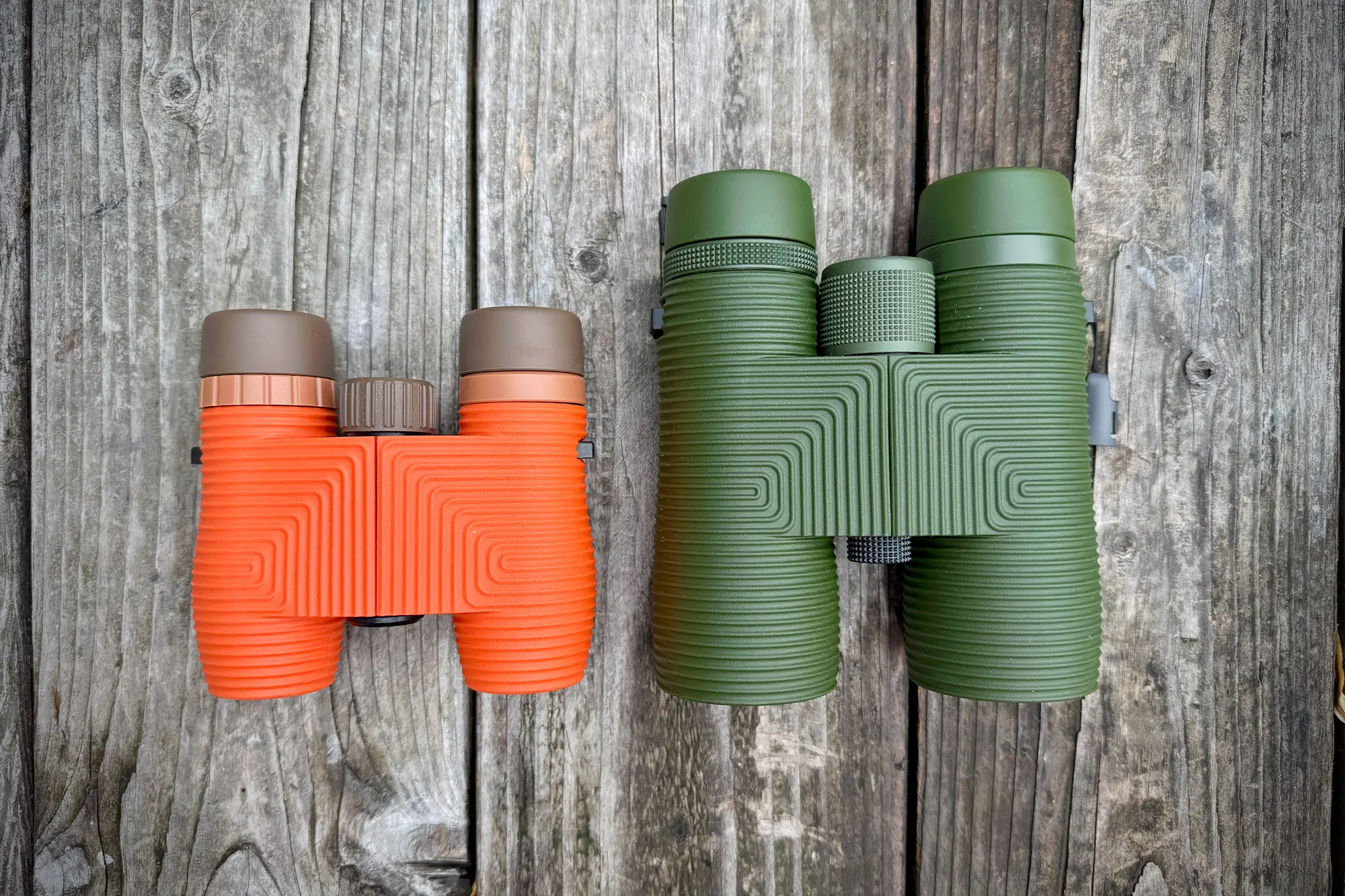 Nocs Pro Issue 8x42 next to a smaller standard model, showing the size difference