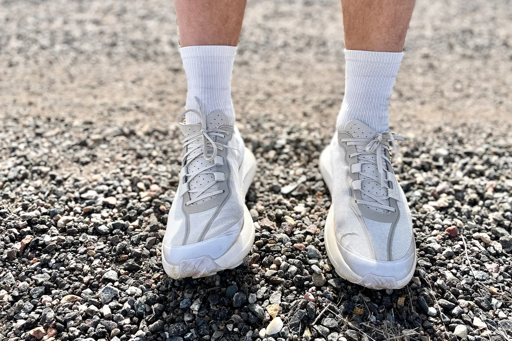 Norda 005 on feet worn on gravel, paired with white socks