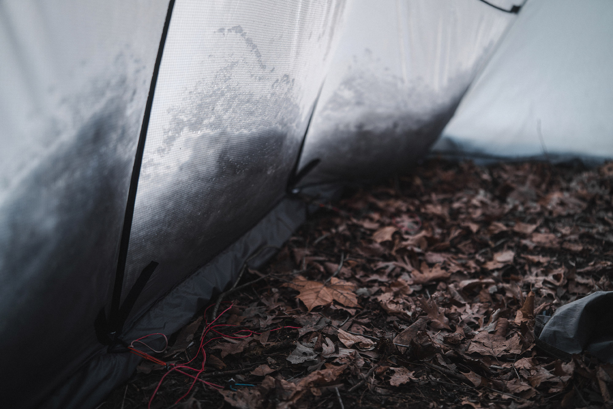 Inside the Warbonnet Tsunami, with poles bracing against snow-packed walls