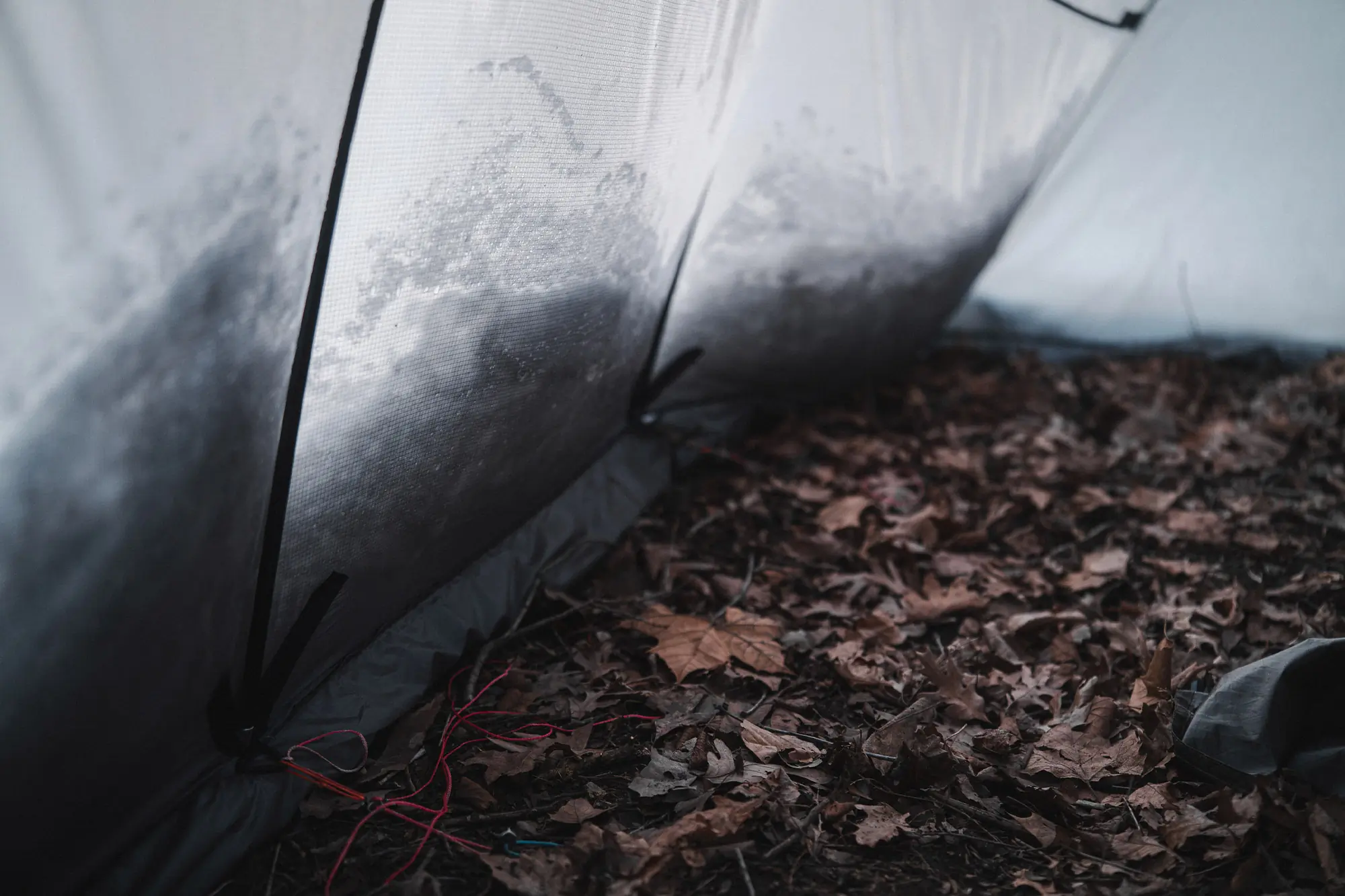 Inside the Warbonnet Tsunami, with poles bracing against snow-packed walls