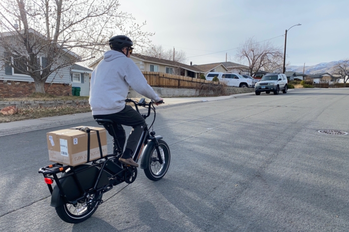 Riding the RadWagon 5 up a hill in a neighborhood