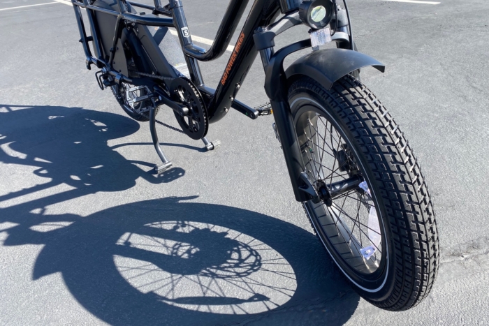 The upgraded suspension fork, tires, and kickstand on the RadWagon 5