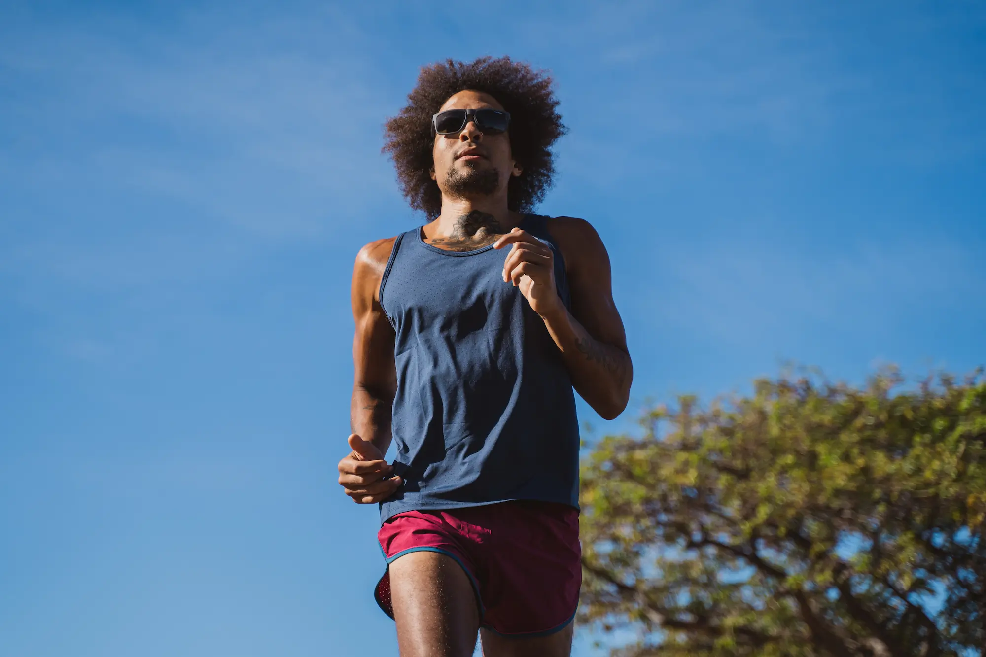 Man running with sunglasses