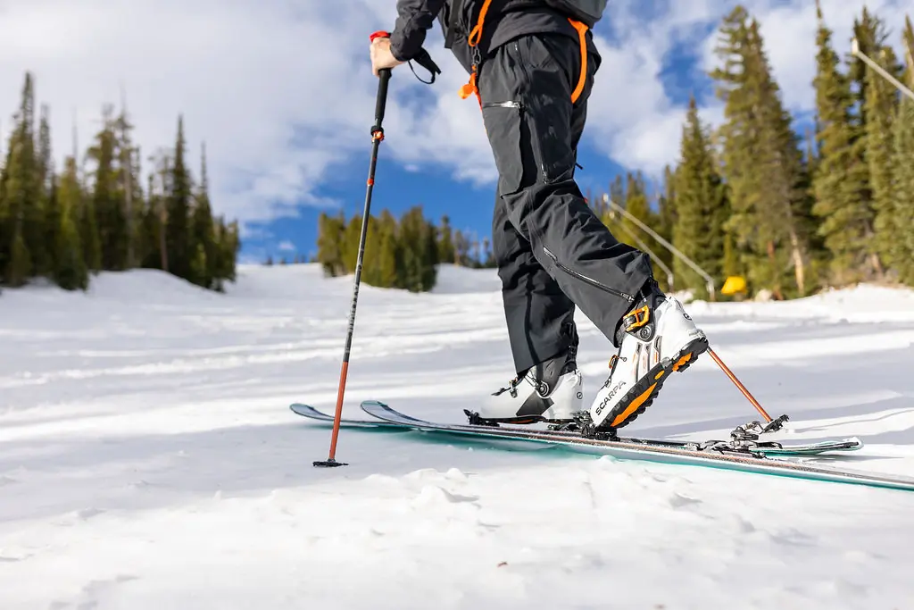 A skier moves uphill with the Salomon MTN Pure bindings in walk mode