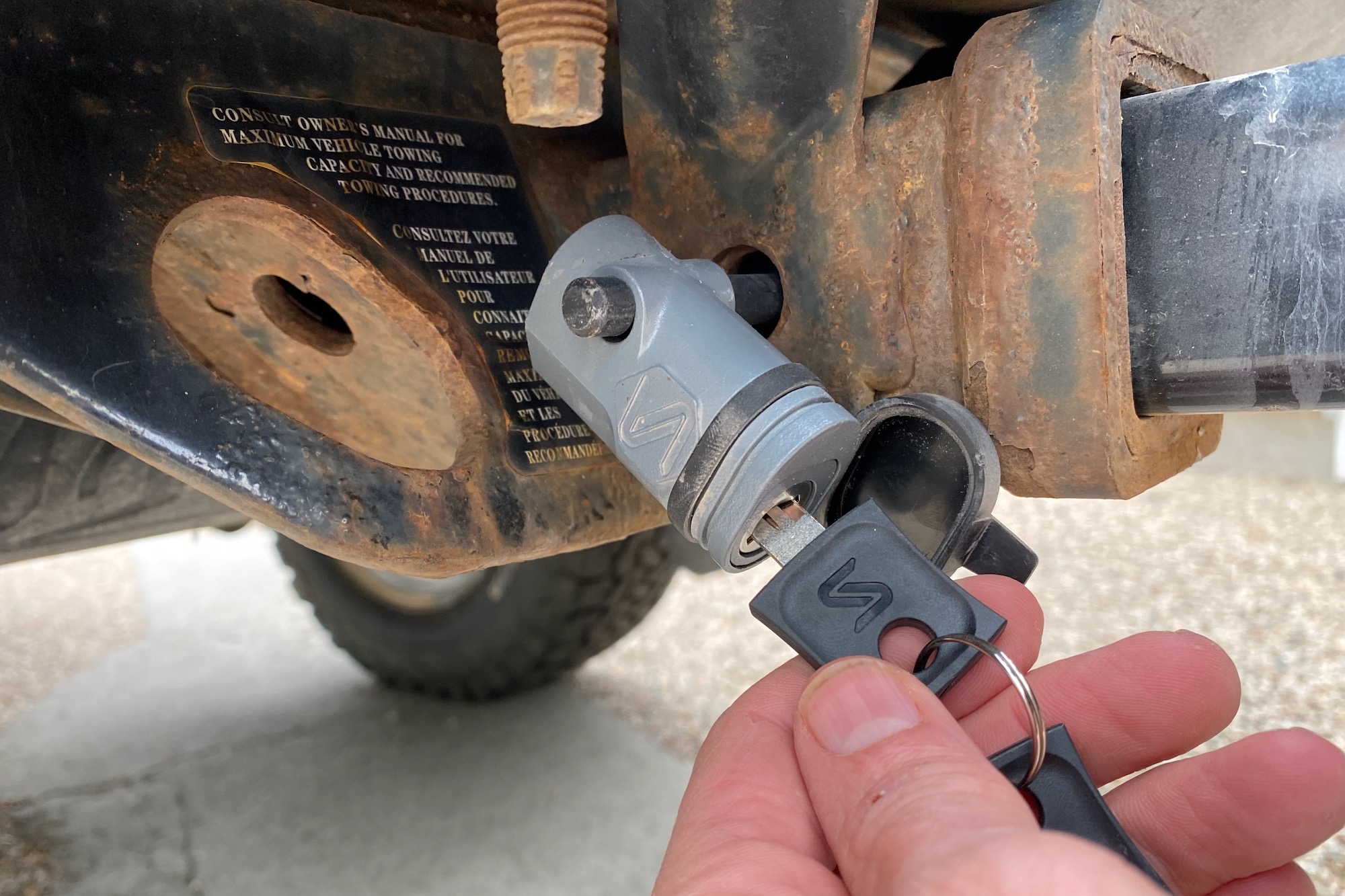 The metal hitch pin lock