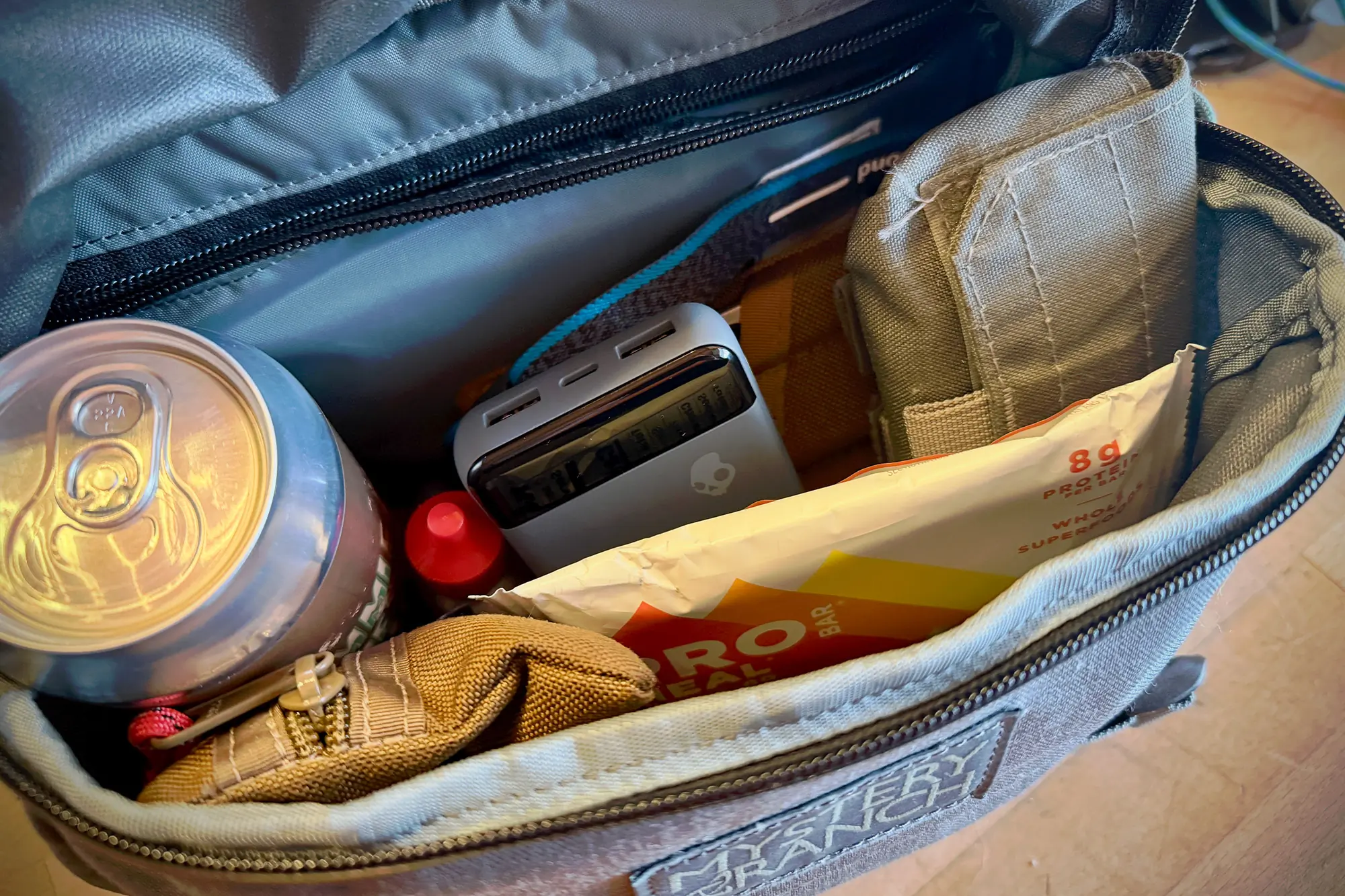 The Skullcandy Fat Stash 2 power bank placed inside a bag with other items