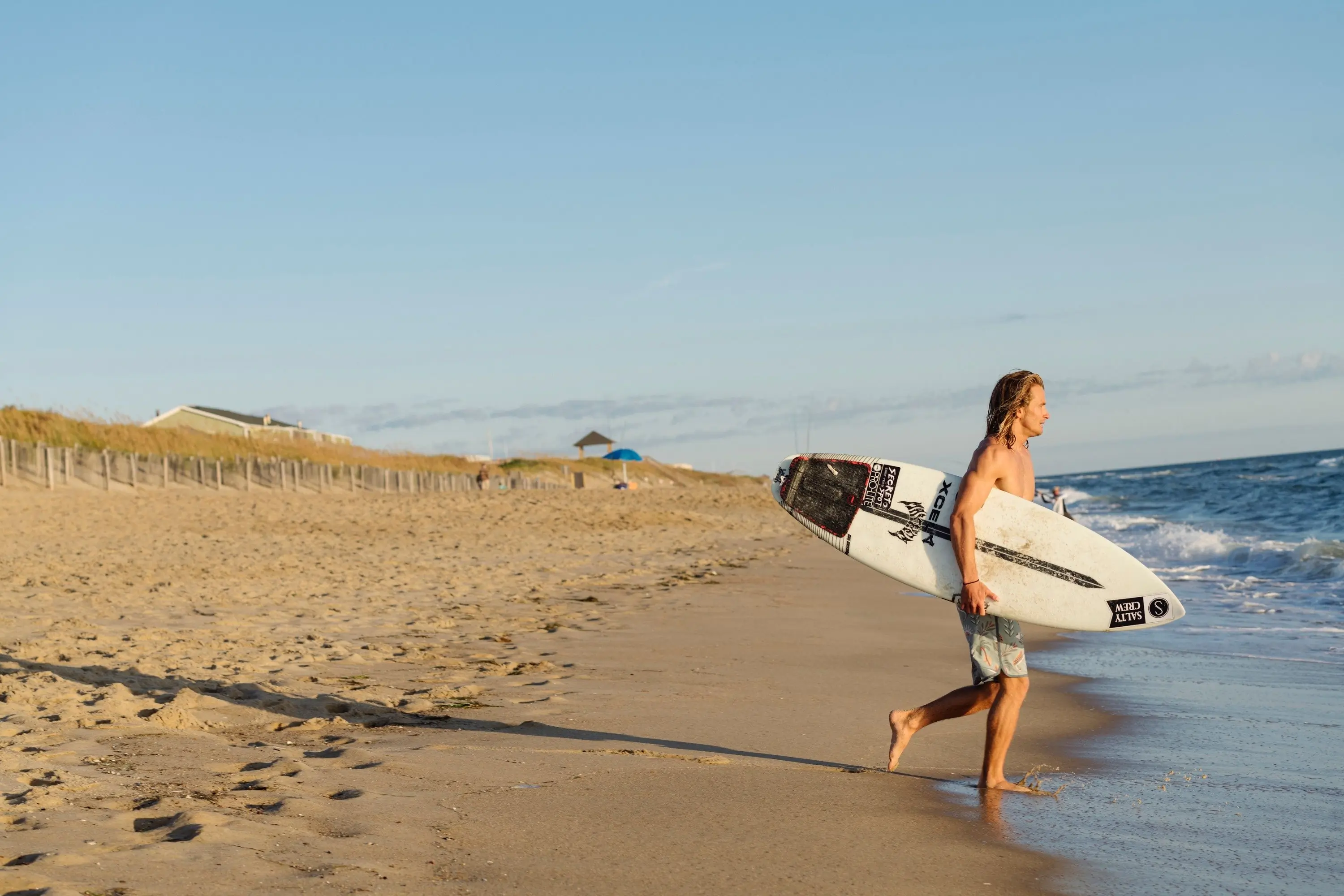 Surfer on the beach in North Carolina