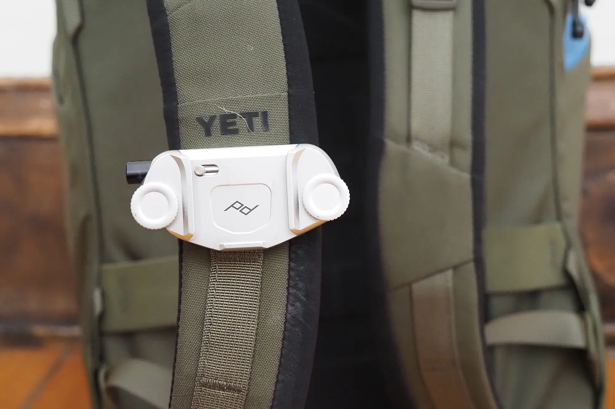 camera holster clipped to yeti ranchero backpack shoulder strap