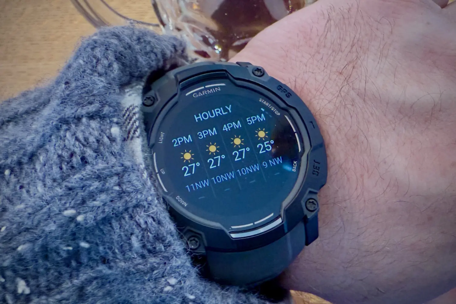 Garmin Instinct 3 displaying an hourly weather forecast