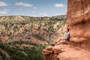 Man,Sitting,On,The,Edge,Of,The,Lighthouse,Rock,,Palo