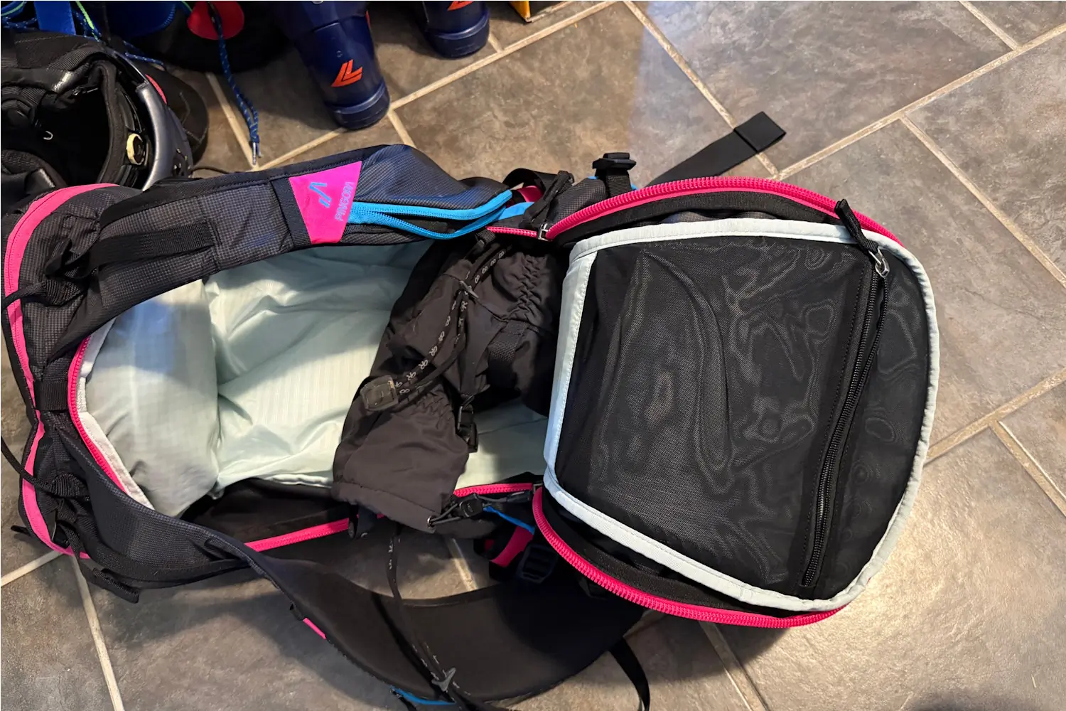 Top view of the Pingora Vivid 27L backpack showing a mesh zippered pocket and storage space