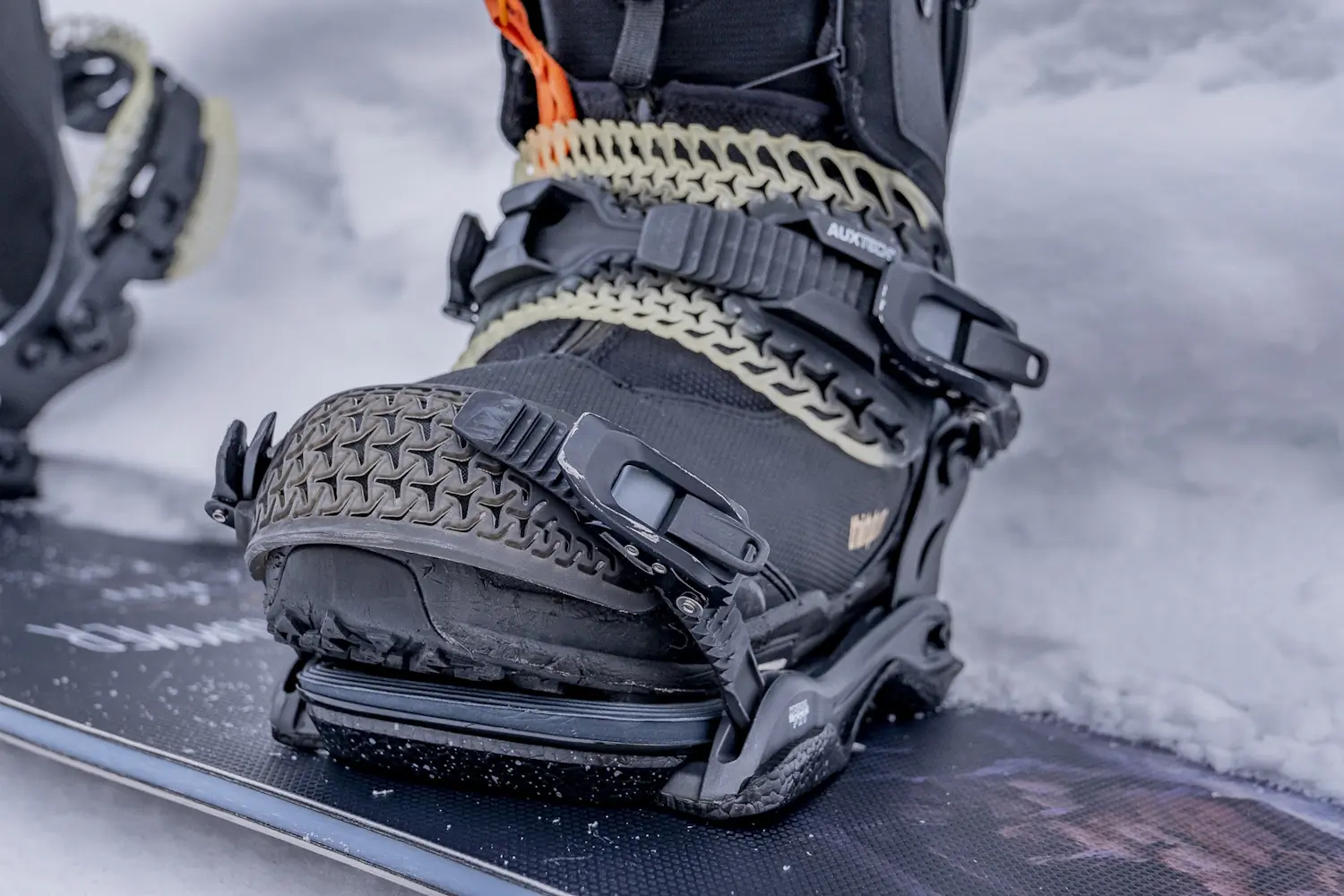 Close-up of a snowboard boot secured in the Rome Katana Pro binding highlighting the ankle strap