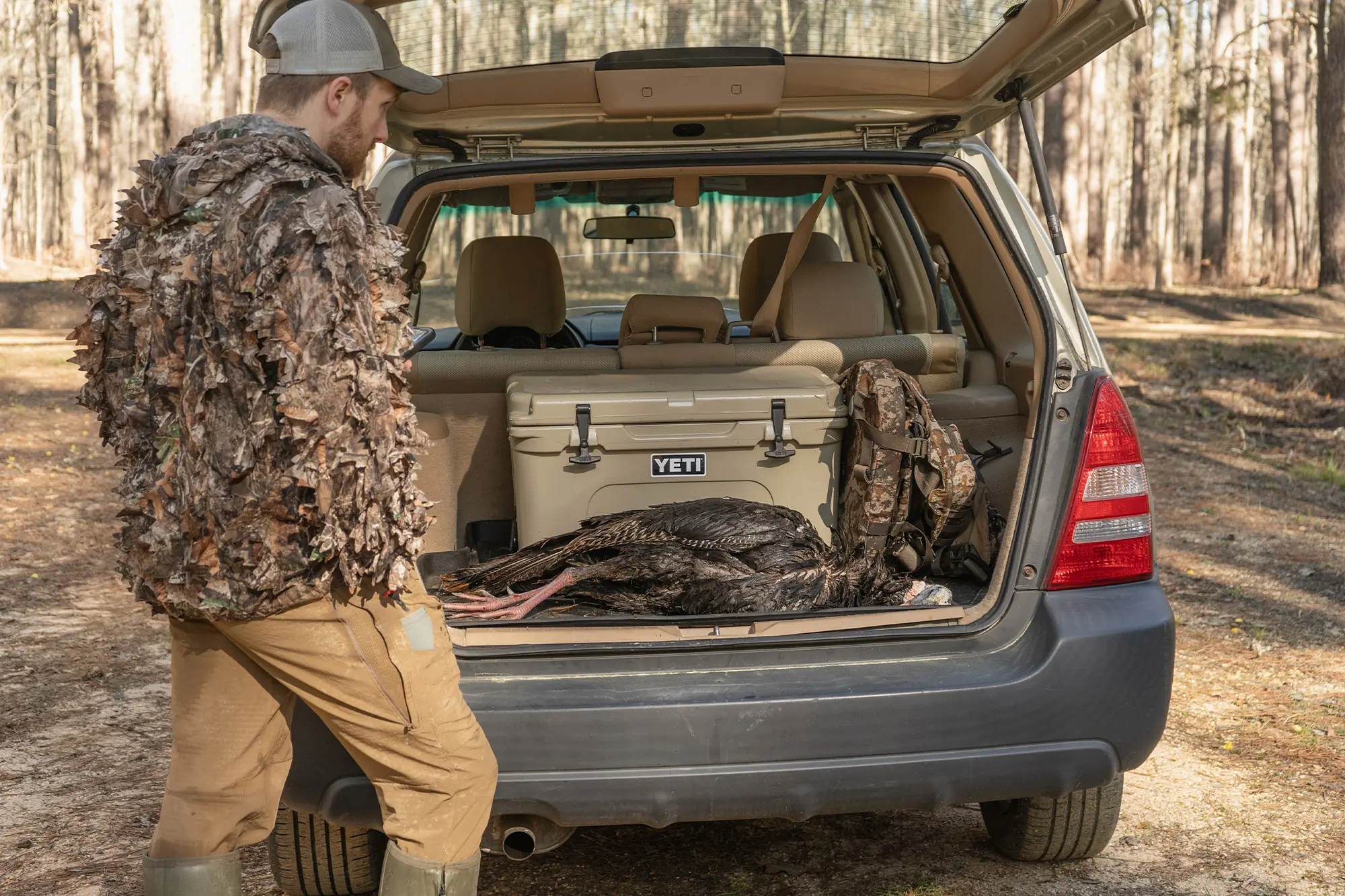 A successful hunt with Chêne Floodline Velo Boots, showing the harvested bird in the trunk