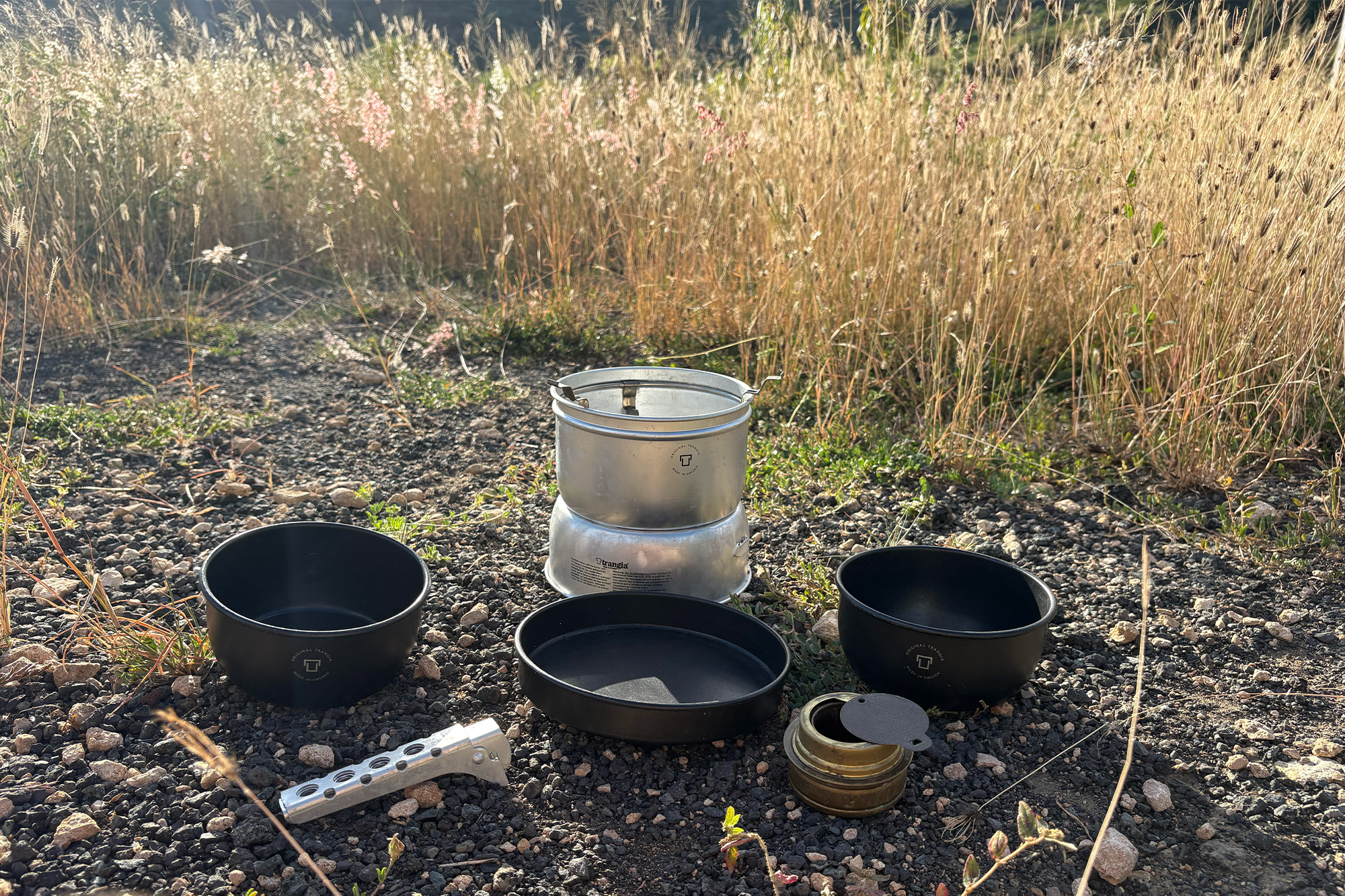 Trangia 27-5 Stove with components laid out in an outdoor setting