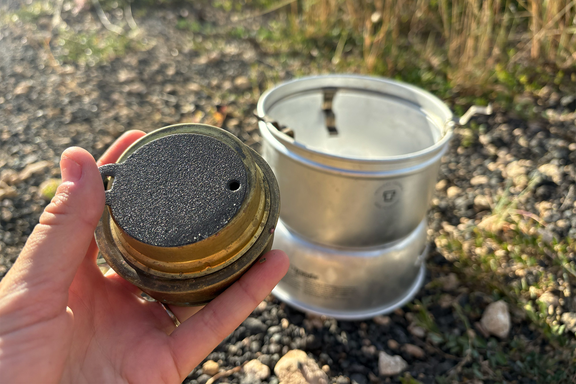 Trangia 27-5 Stove with components laid out in an outdoor setting