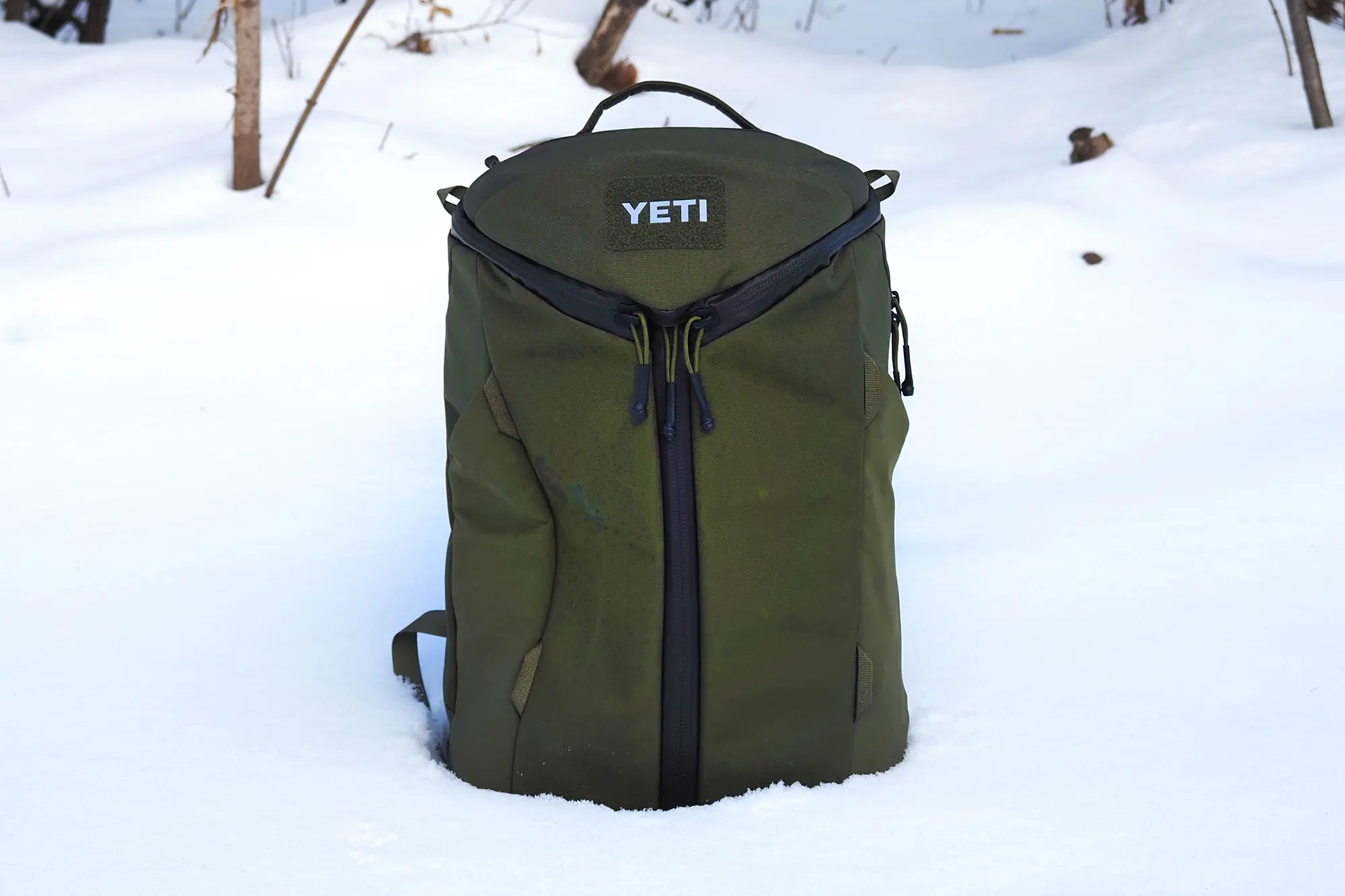 yeti ranchero backpack standing in snow