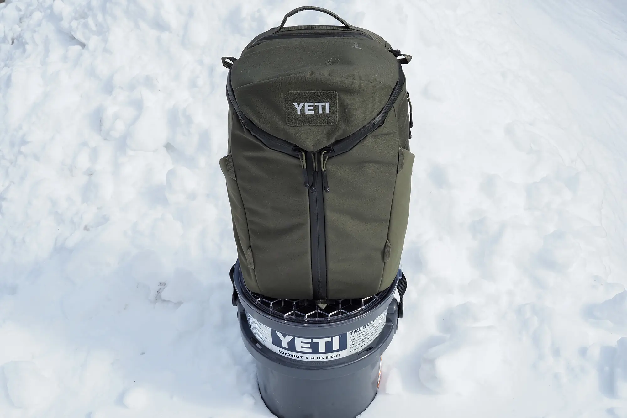 yeti ranchero backpack standing on yeti bucket