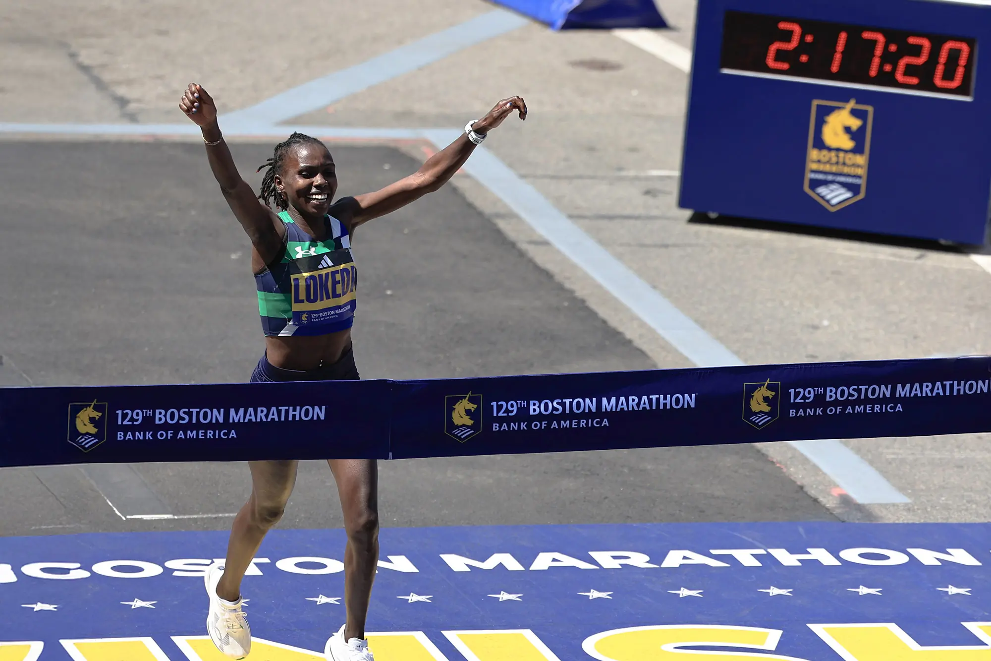 Sharon Lokedi crosses finish line at Boston Marathon in Under Armour Velociti Elite 3 shoes