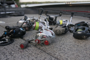 The best bass fishing reels on a boat deck by a lake