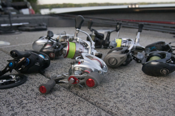 The best bass fishing reels on a boat deck by a lake