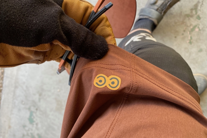 The Curious Creatures logo on the hem of the shorts