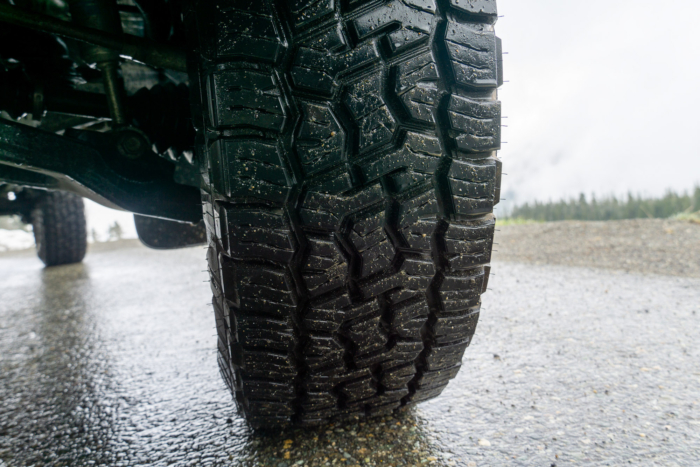 A tight image of the tread pattern on the Nitto Terra Grappler G3s on wet road