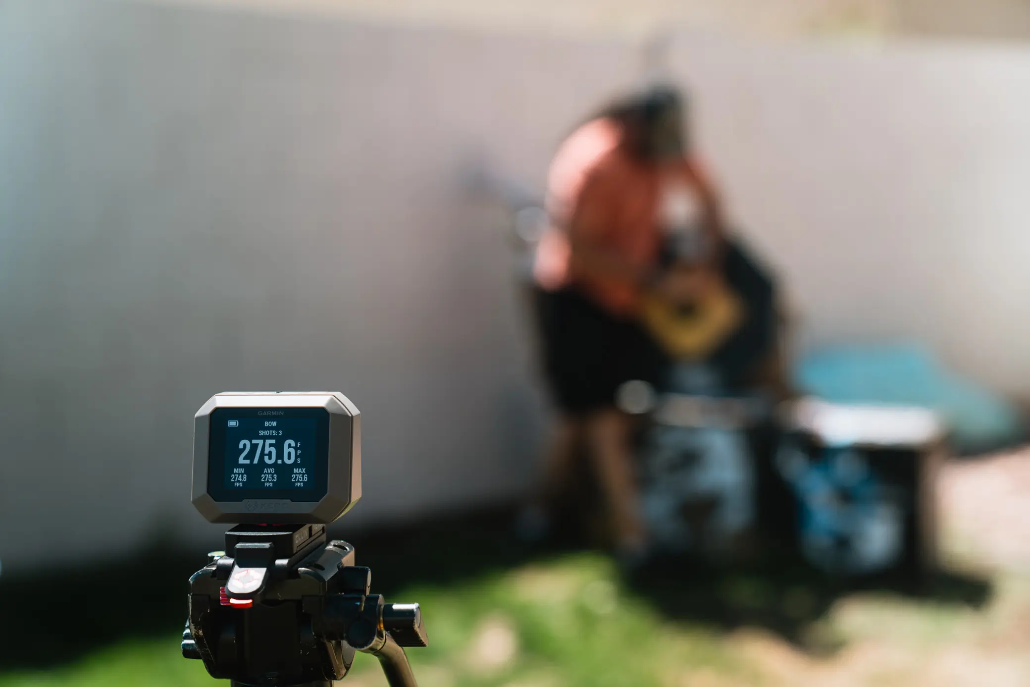 Garmin Xero C1 Pro with blurred man in the background