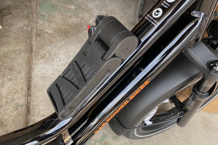 The Foldylock Forever held in its frame mount bracket attached to the Rad Power RadWagon 5