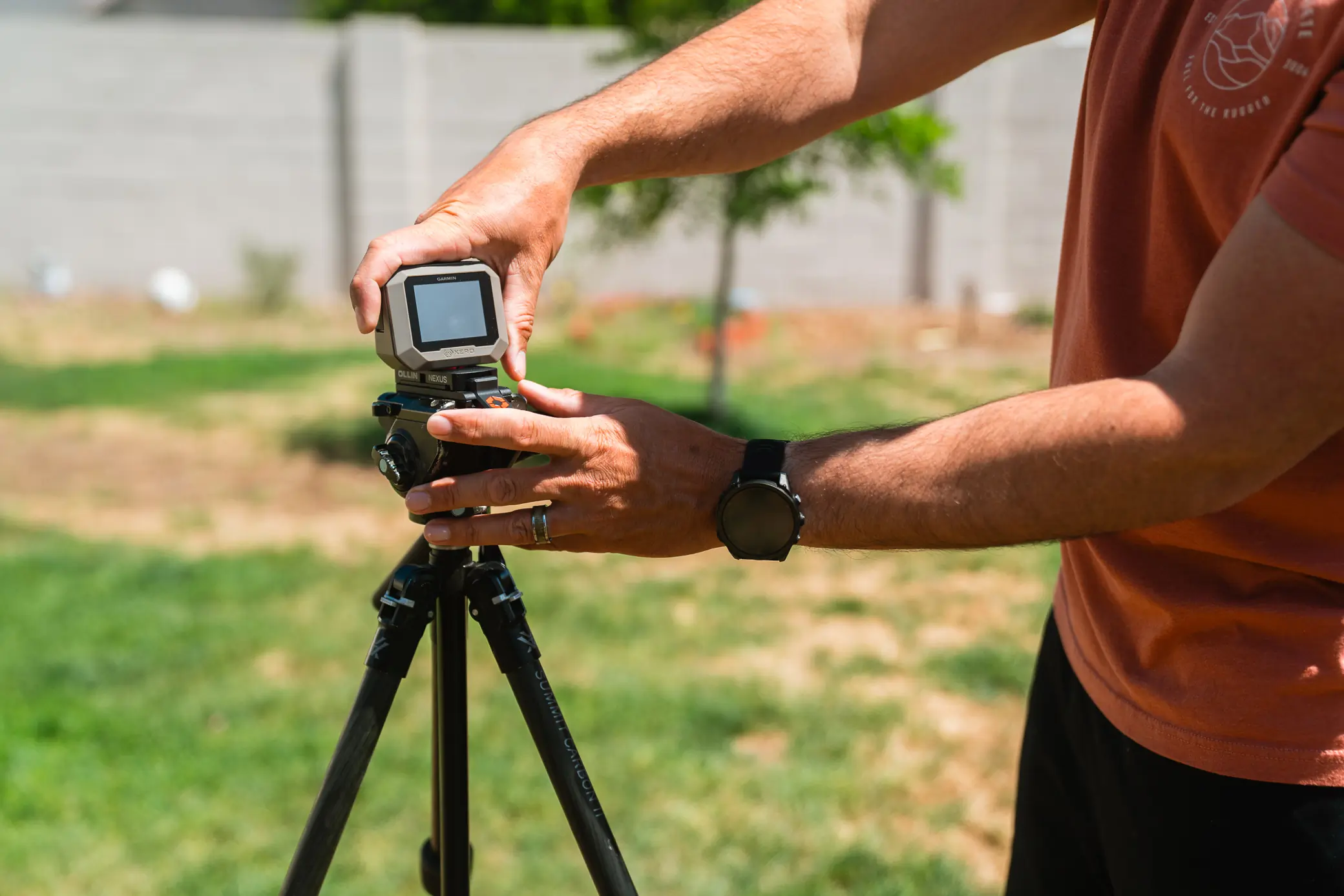 man adjusting Garmin Xero C1 Pro