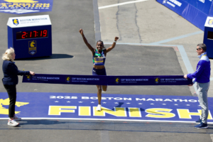 Sharon Lokedi crosses finish line at Boston Marathon in Under Armour Velociti Elite 3 shoes