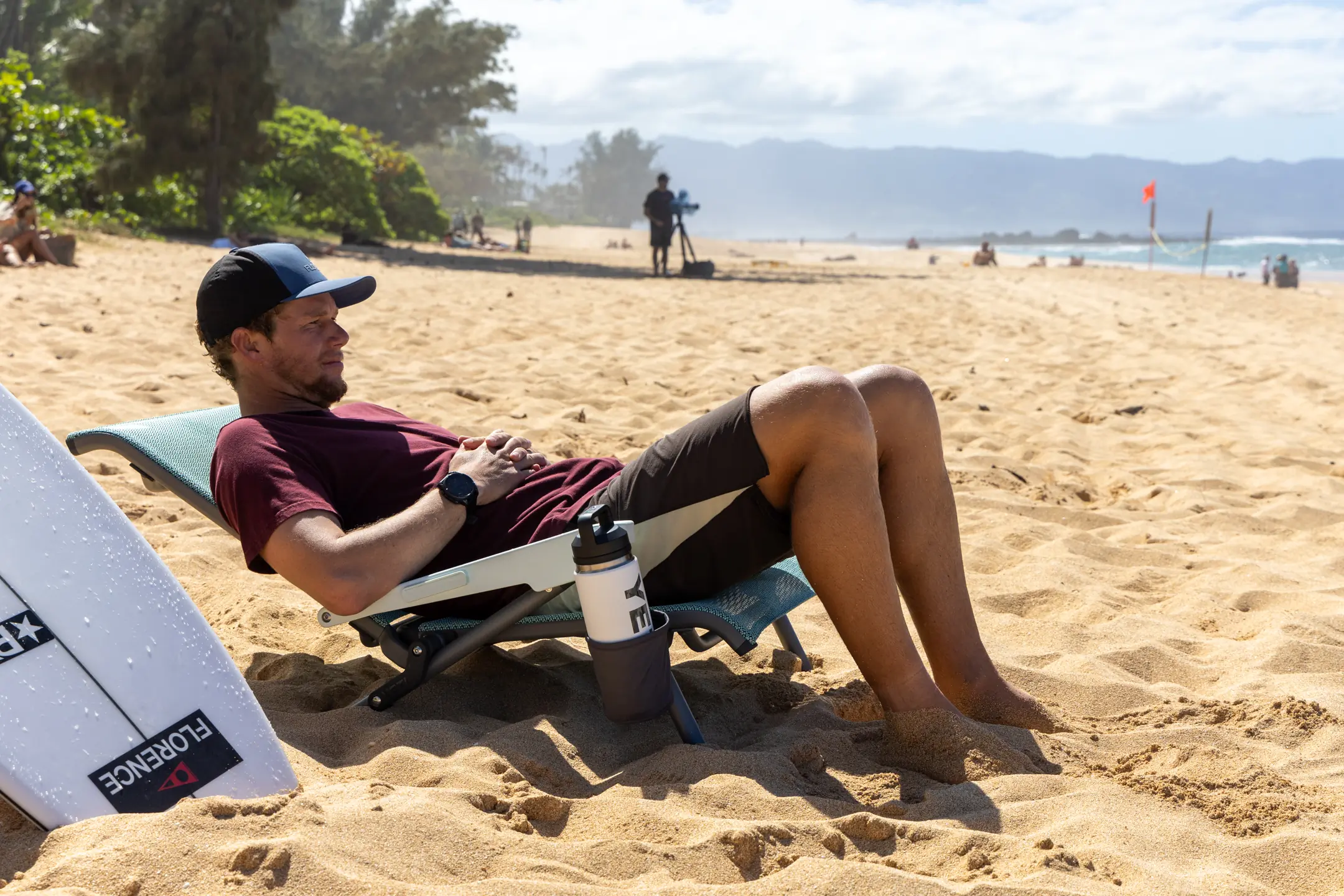 man on beach relaxing in beach chair