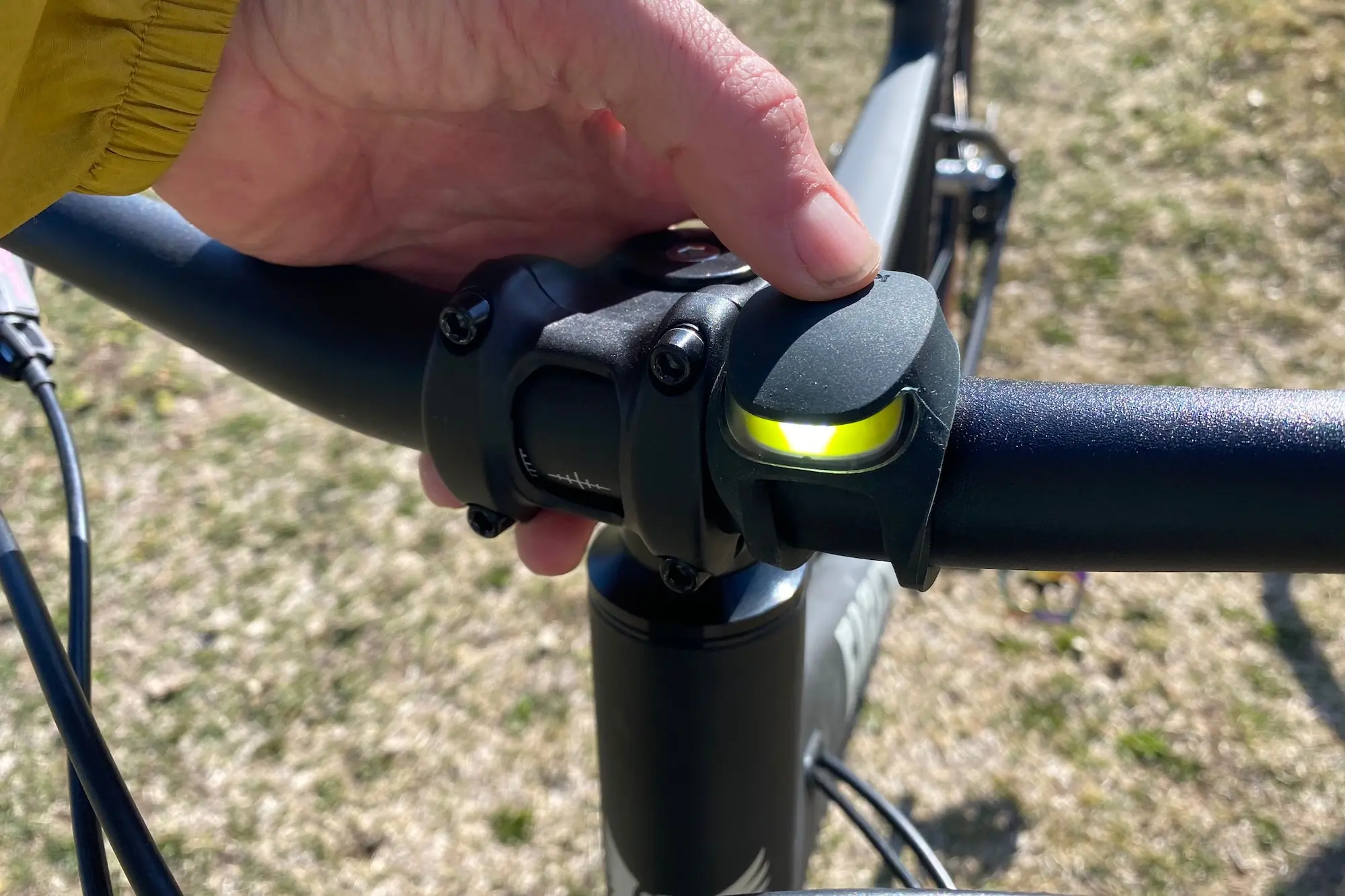 Turning on the Knog Frog front light.