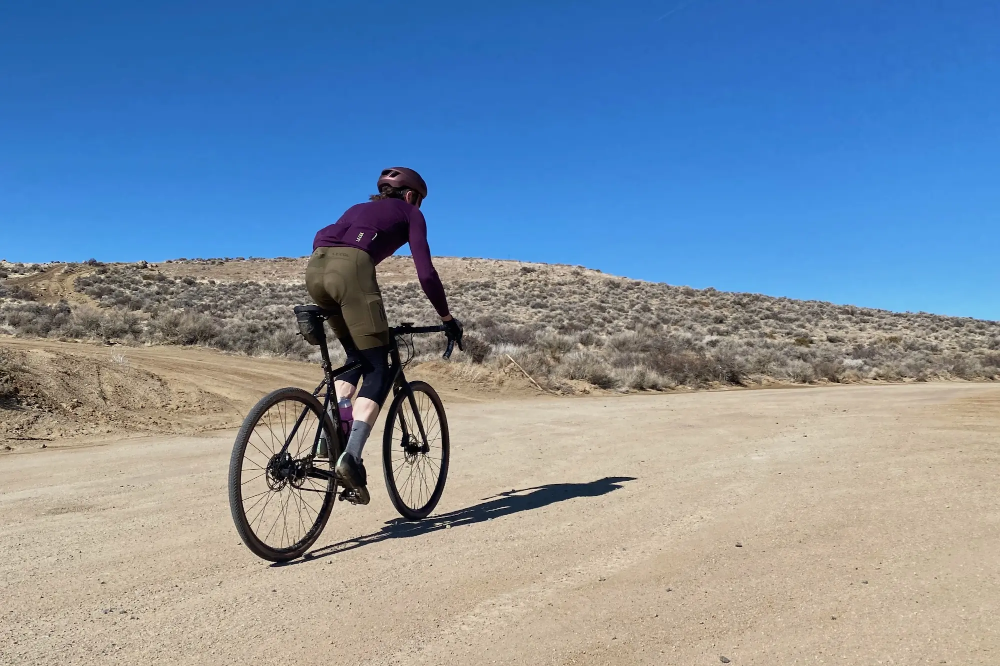 Climbing up a gravel road in Le Col ARC cycling apparel