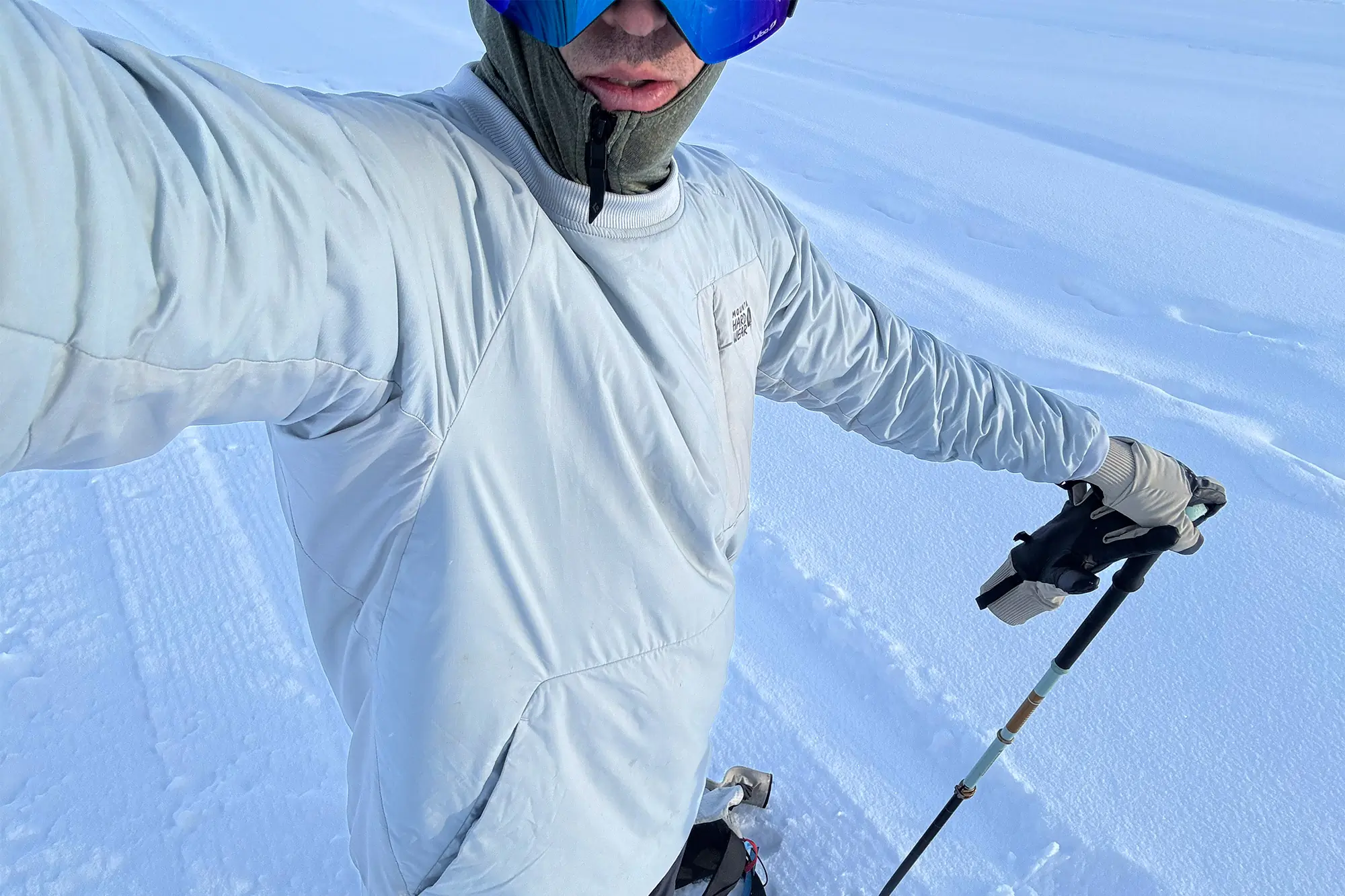 man makes selfie while on slope wearing Mountain Hardwear Kor Alloy Crew