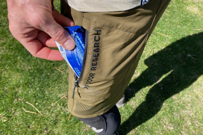 taking a snack out of the side pocket on the Freewheel shorts