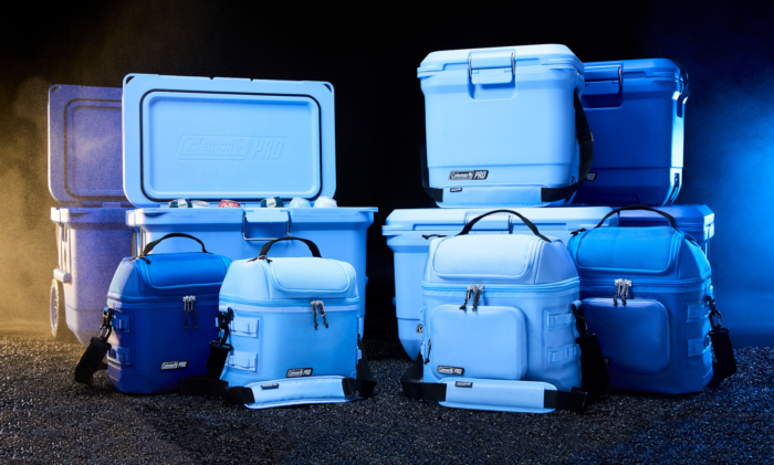 Multiple blue coolers lined up and sitting on each other