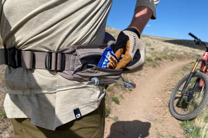 Pulling a snack out of the hip wing pocket on the Raptor 4