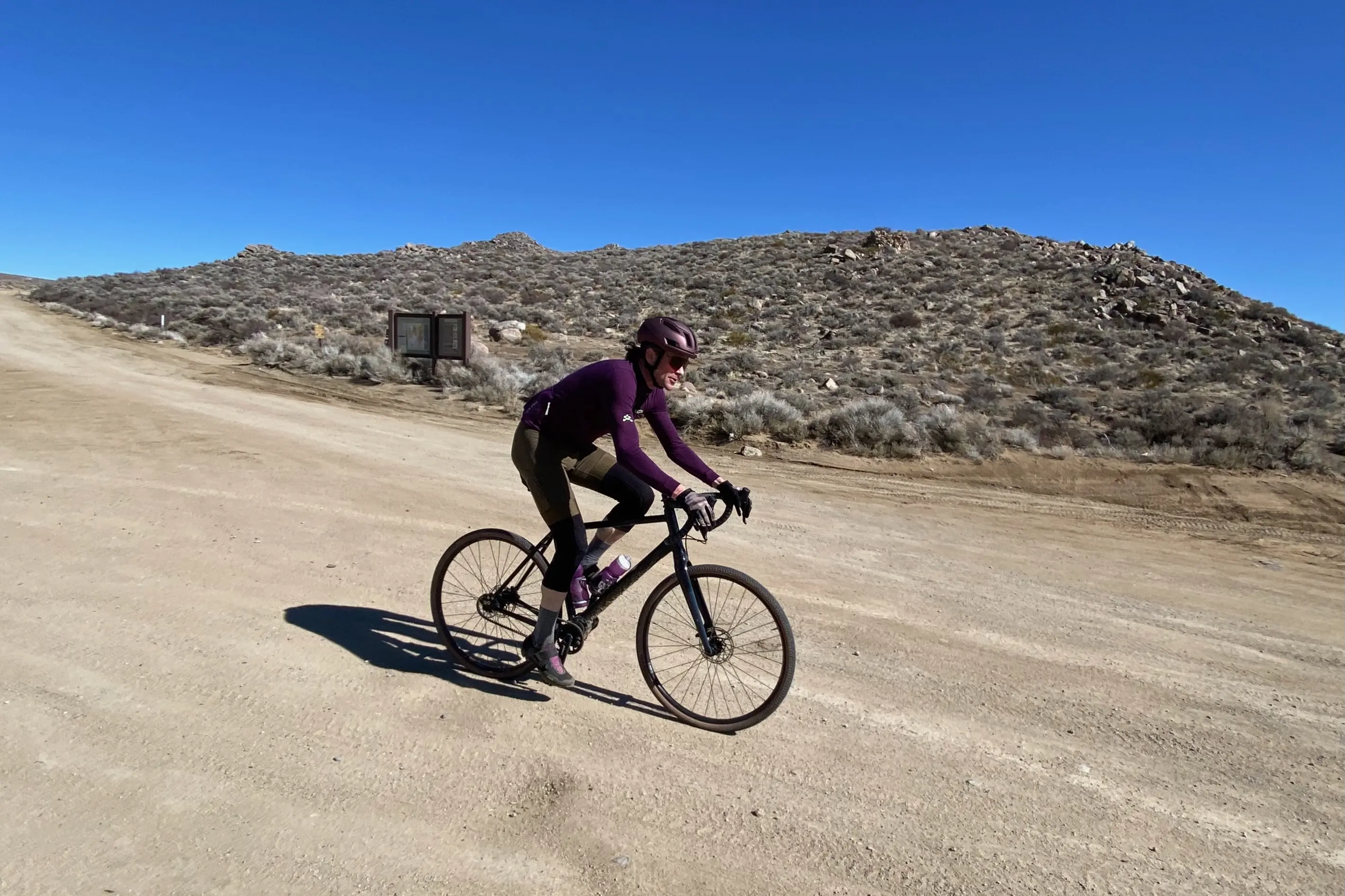 Riding the Priority Gemini gravel bike down a gravel road