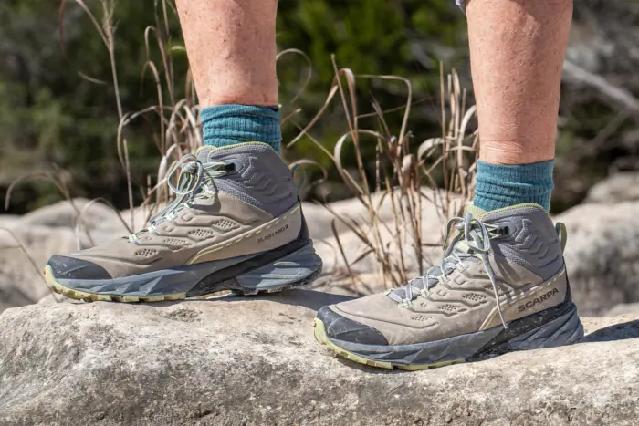 SCARPA Rush 2 Pro Mid GTX worn with teal socks on rocky terrain