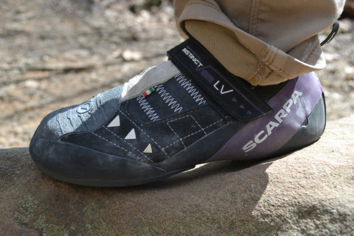 Side view of the Scarpa Instinct VSR LV on a rock