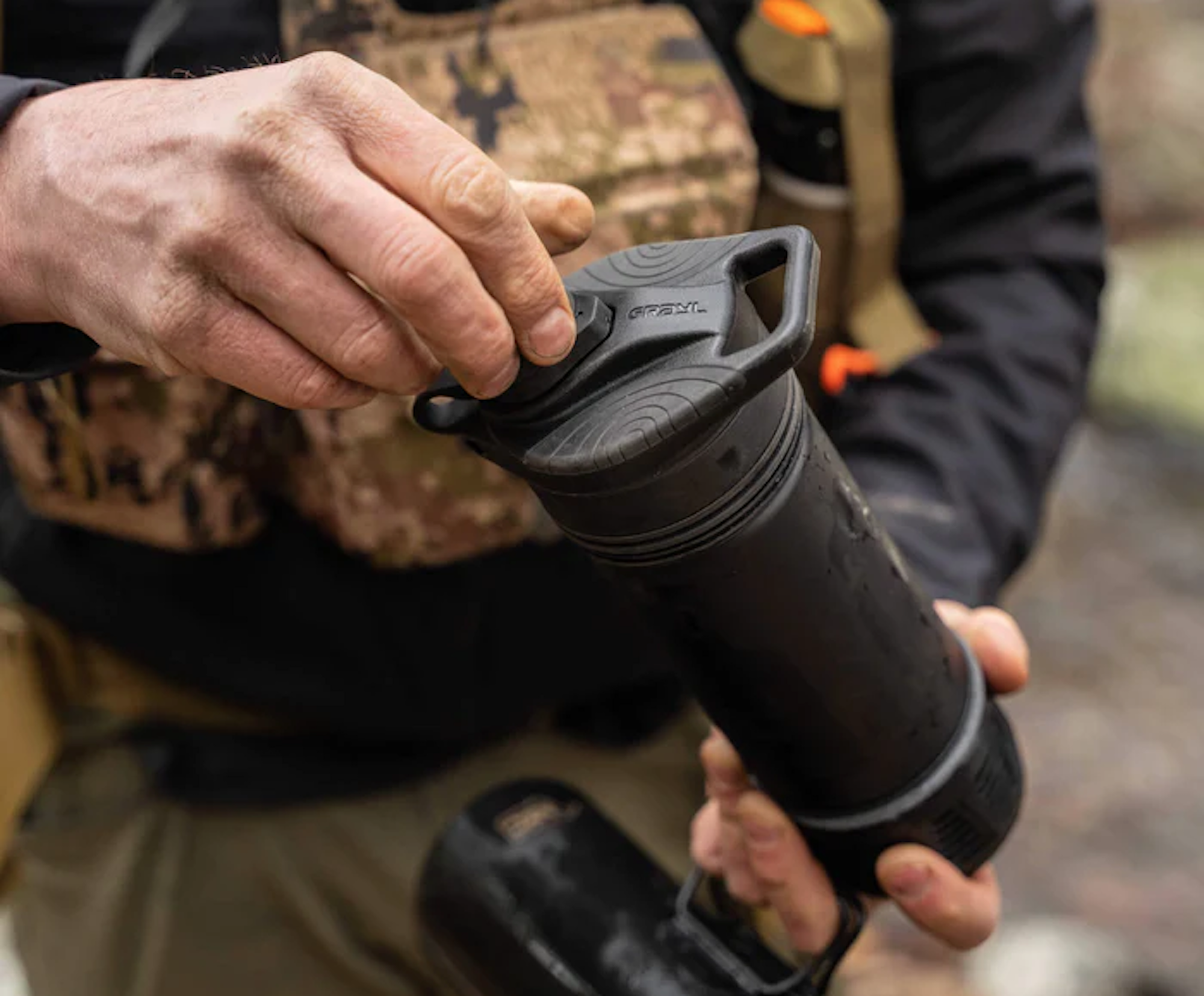 Using water filter press, person in woods