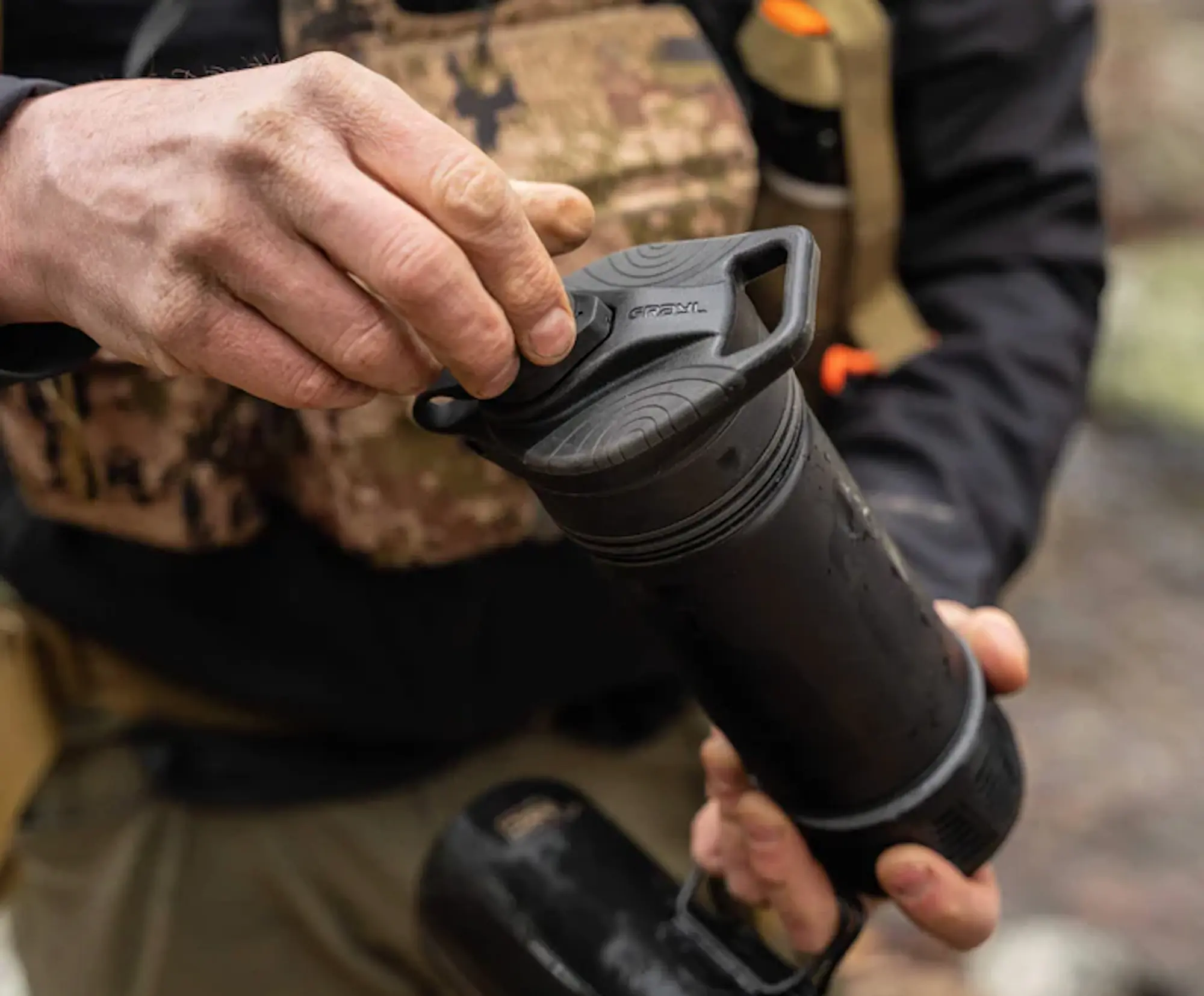 Using water filter press, person in woods