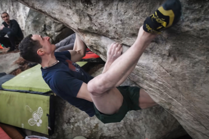 Adam Ondra climbing in the Font