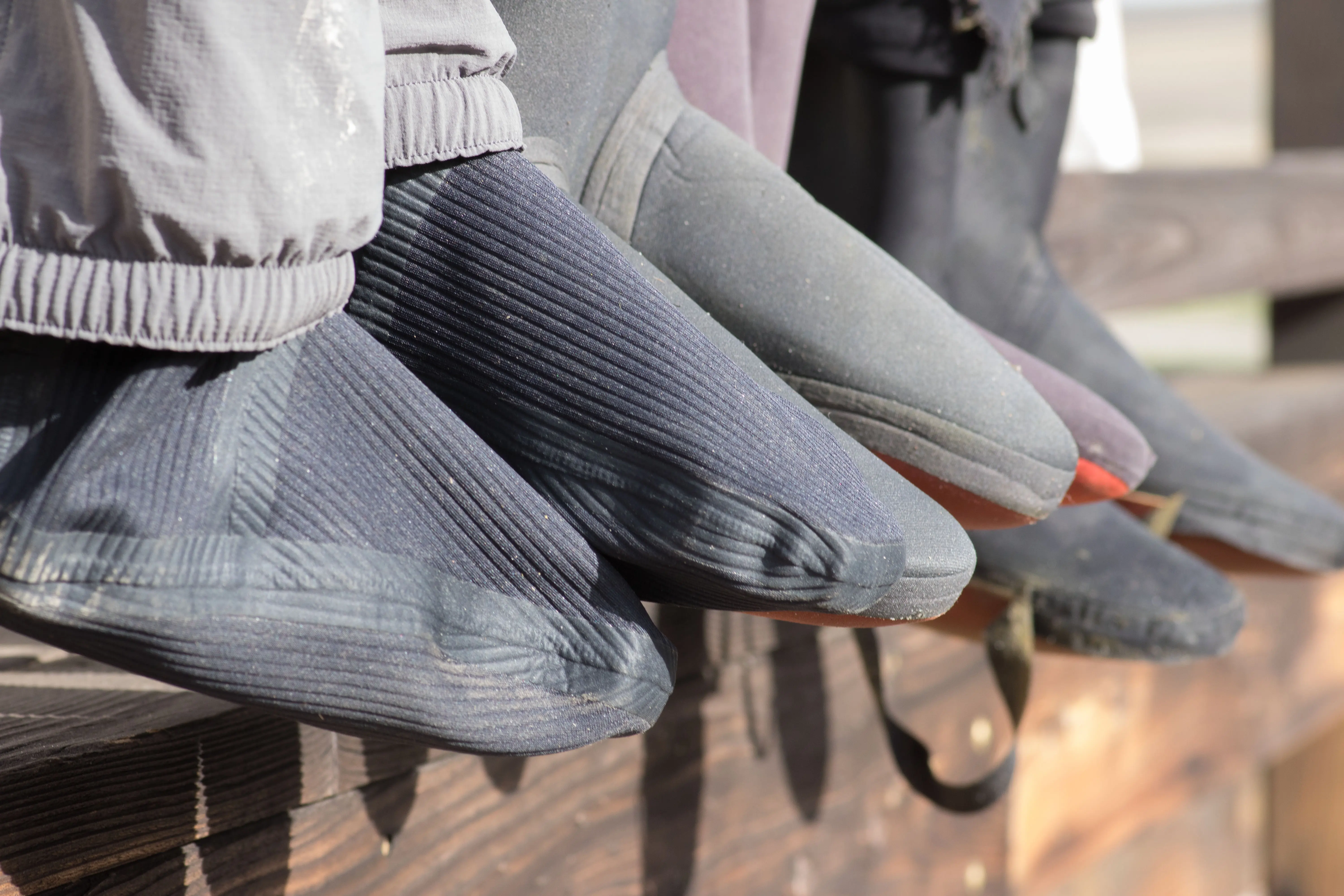 The booties of the Simms Flyweight wader lined up with other waders