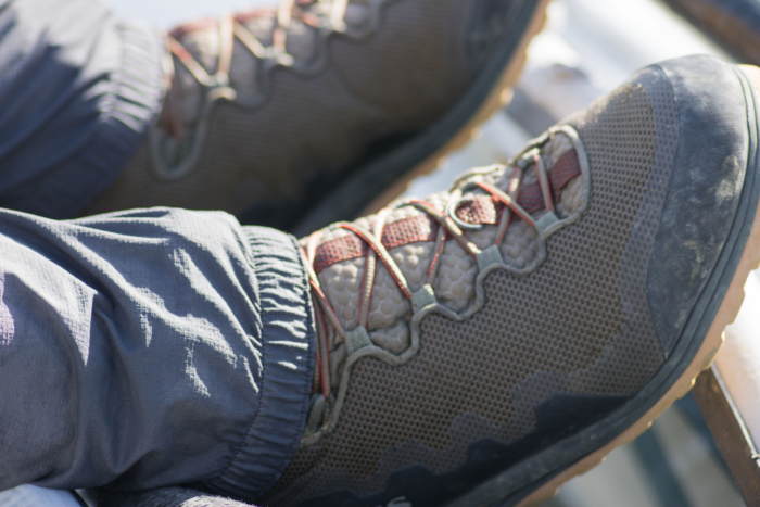 The gravel guards on the Simms Flyweight waders pulled over wading boots.