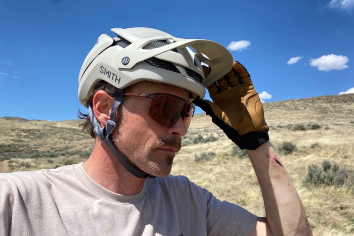 Adjusting the visor on the Smith Forefront 3 mountain bike helmet
