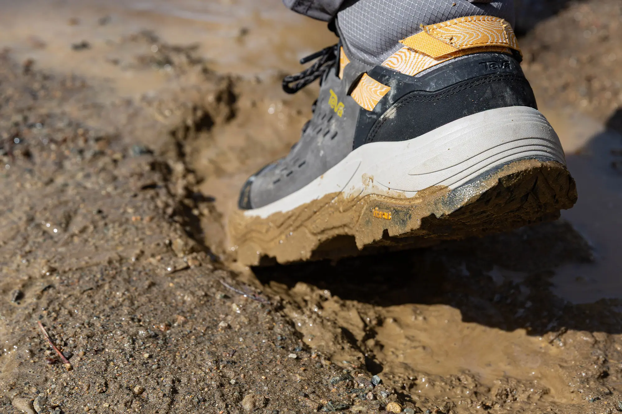 Teva Grandview Max GTX hiking boot stepping into wet mud